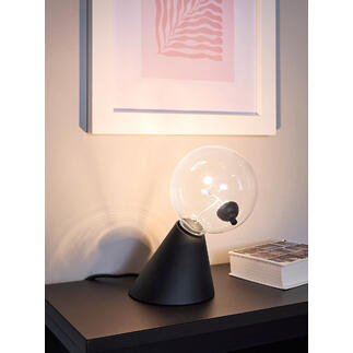 Lampe de table Satellite avec un globe en verre transparent et une base noire sur une étagère.