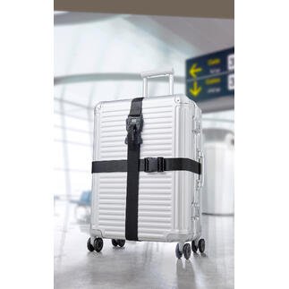 Valise argentée avec ensemble de ceintures de bagages noir 3-en-1 à l'aéroport.