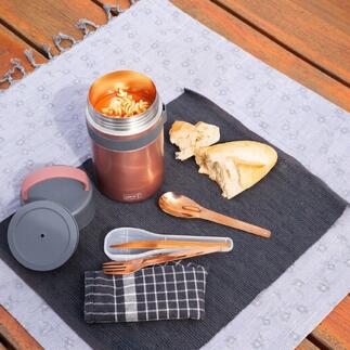Boîte à snacks isolante en rosé avec couvercle ouvert, à côté du pain et des couverts sur une couverture.