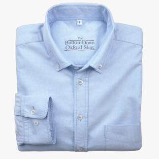 Chemise bleu clair, pliée, taille 38 cm avec col à boutons.