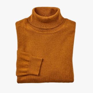 Pull col roulé en tricot fin curry, plié.