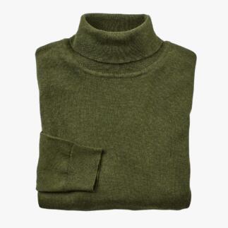 Pull fin vert roulé, plié.