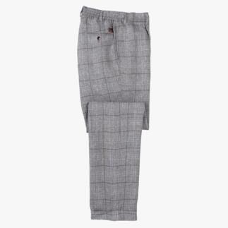 Pantalon en lin Quadro gris plié sur une surface.