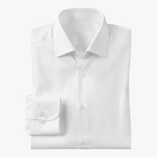 Chemise blanche, soigneusement pliée avec un bouton sur la manche.