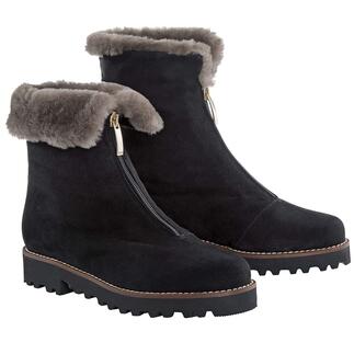 Deux bottes OCONI curling noires sur fond blanc
