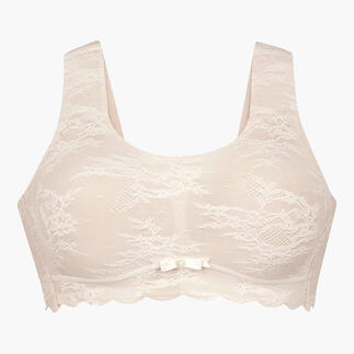 Bralette en dentelle beige avec des bretelles larges et un nœud au milieu.