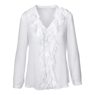Blouse blanche avec volants et col en V, avec des manches longues et des volants à l'avant.