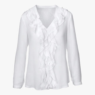 Blouse blanche avec volants et col en V, avec des manches longues et des volants à l'avant.