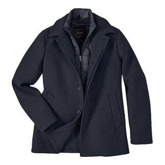 Manteau en laine respirant posé sur une surface plane.