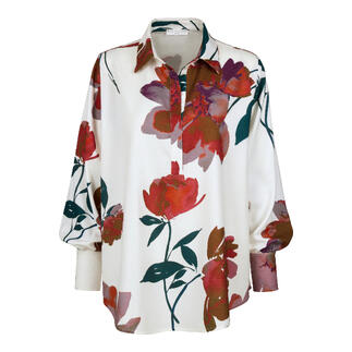 Chemise crème avec motif floral coloré et manches lâches.