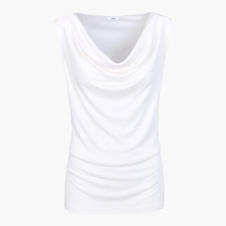 Top blanc à cascades en tissu doux et fluide.