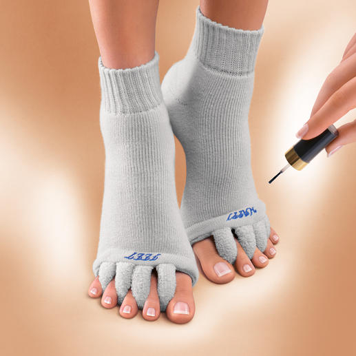 Chaussettes wellness “Happy Feet” Délassement des pieds meurtris par les escarpins. Chaussettes détente pour vos orteils, brevetées aux USA.