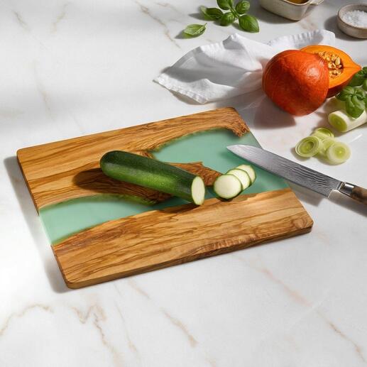 Planche à découper River-Design avec surface verte et une tranche de concombre dessus