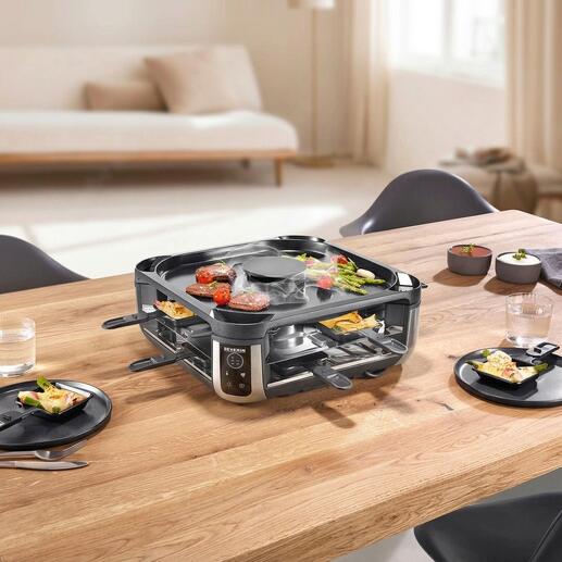 Gril à raclette avec extraction de fumée intégrée sur une table dressée.