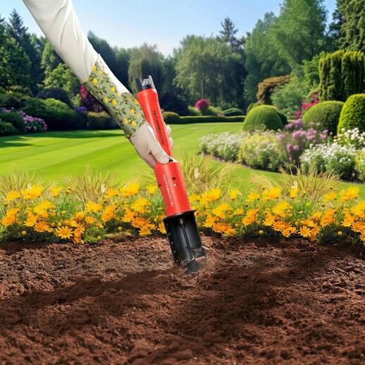 Perceuse à batterie dans un jardin fleuri