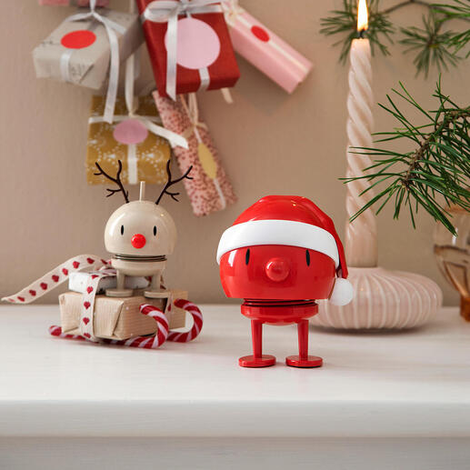 Bonhomme de neige Hoptimist dans une décoration de Noël avec des cadeaux.