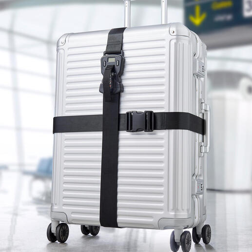 Valise argentée avec ensemble de ceintures de bagages noir 3-en-1 à l'aéroport.