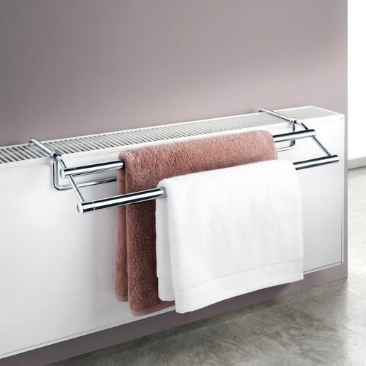 Sèche-serviettes monté au-dessus d'un radiateur avec des serviettes.