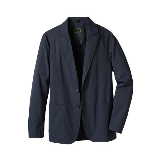 Revers de la veste Travel-Light bleue sur une table.