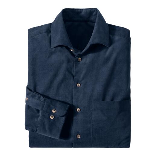 Chemise en velours côtelé bleu marine avec longues manches et une poche poitrine, pliée de manière décontractée.