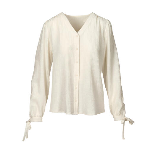 Blouse en coton-cachemire claire à manches longues et liens à nouer.