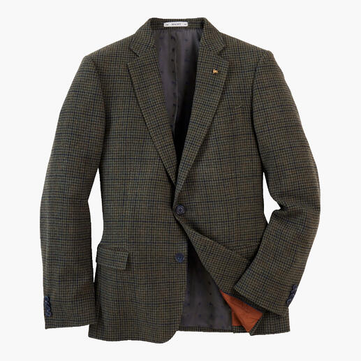 Blazer à carreaux sur fond blanc.
