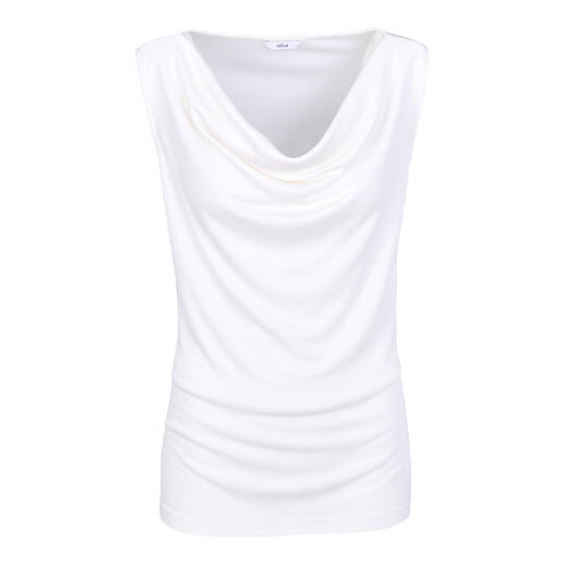 Top blanc à cascades en tissu doux et fluide.