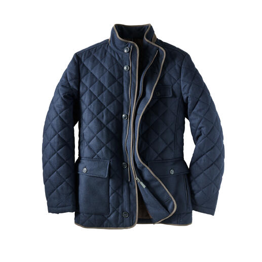 Veste matelassée bleue avec poches et fermeture éclair.