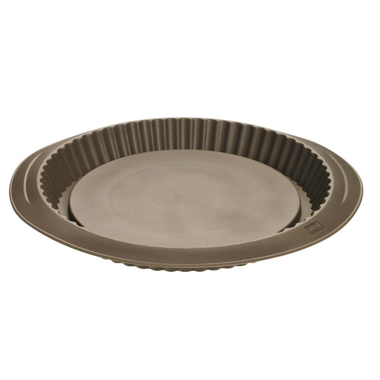 Moule à tarte en silicone de forme ronde avec bord festonné.