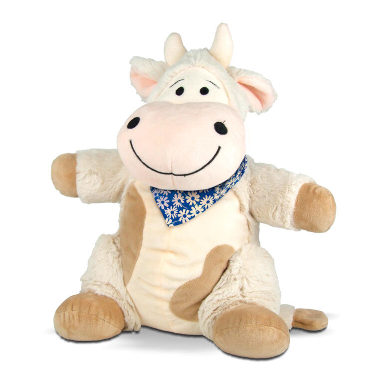 Peluche vache de couleur bleue, assise joyeusement