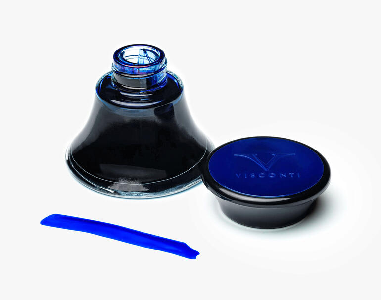 Bouteille d'encre Visconti ouverte, liquide bleu visible