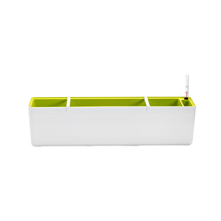Bac à fleurs blanc avec des inserts verts, parfait pour planter des fleurs.