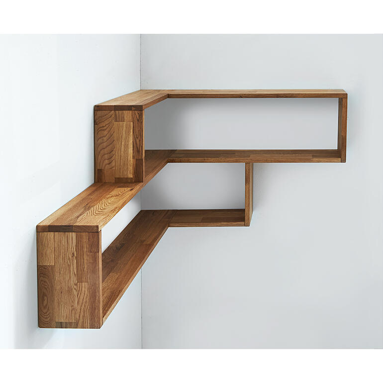 Étagère d'angle murale en bois au design minimaliste, fixée à un mur blanc.
