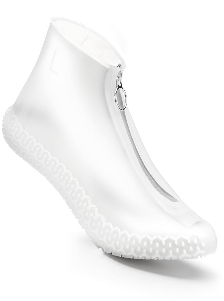 Blanc Surchaussures en caoutchouc blanches avec fermeture éclair et semelle antidérapante.