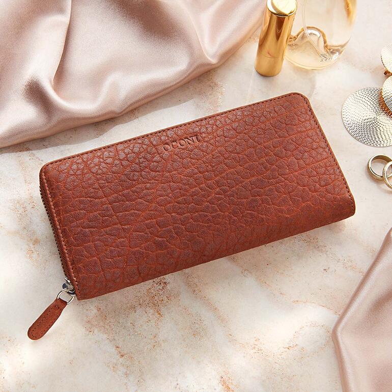 Portefeuille pour femmes OCONI en cuir de bison sur un élégant fond en tissu