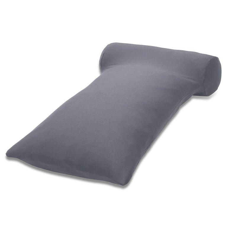 Coussin de lecture HEFEL gris reposant sur une table.