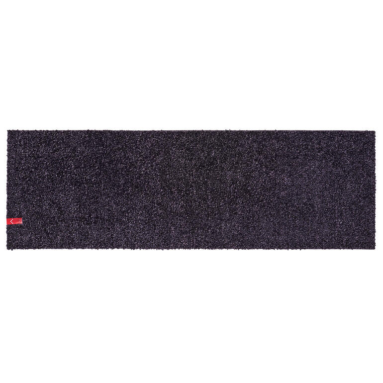 Tapis de porte de terrasse noir en forme rectangulaire.