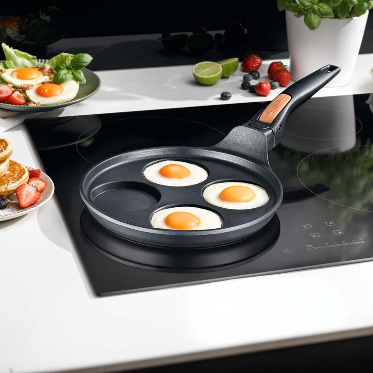 Poêle à quatre cavités sur la cuisinière