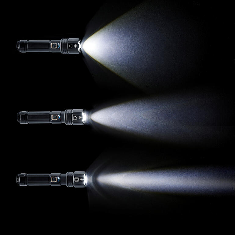 Lampe de survie avec trois niveaux de lumière sur fond noir.