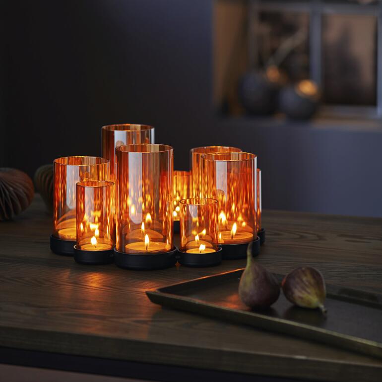 Lanterne Lichtermeer en verre orange avec des bougies.