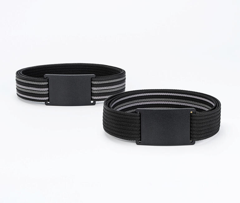 Deux ceintures réversibles cleverbelt Vario en noir et gris sur une table.