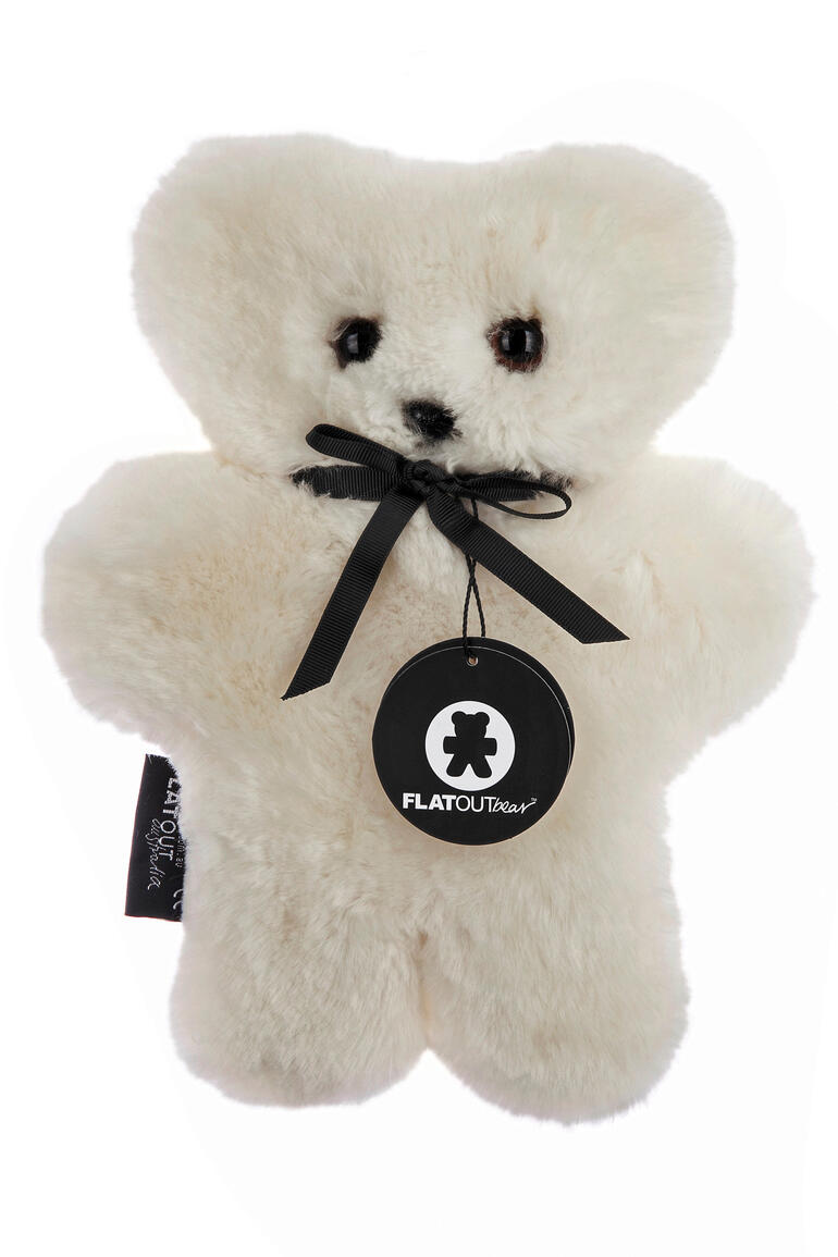 Disponible au choix en blanc crème ou taupe. Ours en peluche en peau de mouton blanc crème avec un nœud
