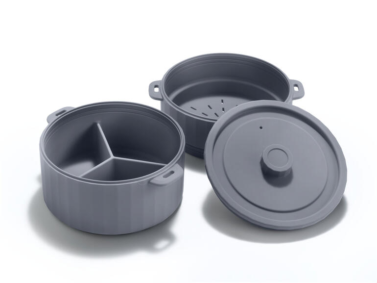 Cuiseur à vapeur à deux niveaux en gris, démonté avec un couvercle.