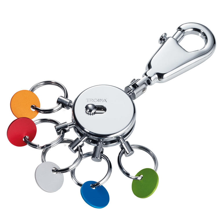 L’organisateur de clés Organisateur de clés avec porte-clés de différentes couleurs sur fond blanc.