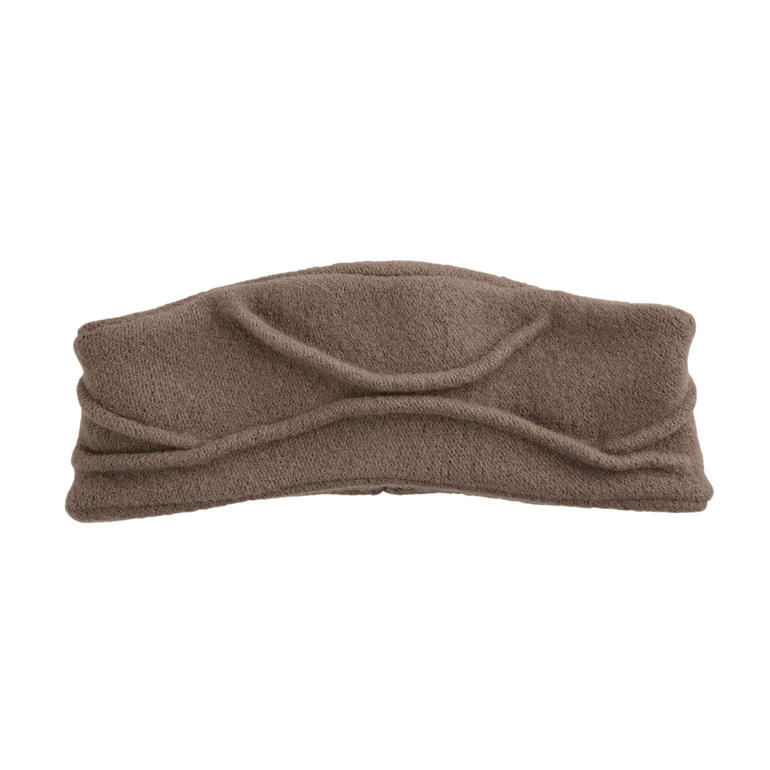 Bandeau gris-beige avec design texturé sur fond clair.