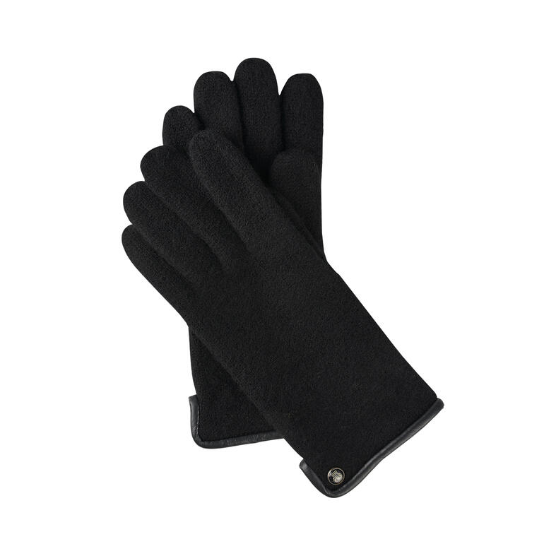 Noir Gants de marche noirs avec une texture agréable tenus dans la main.