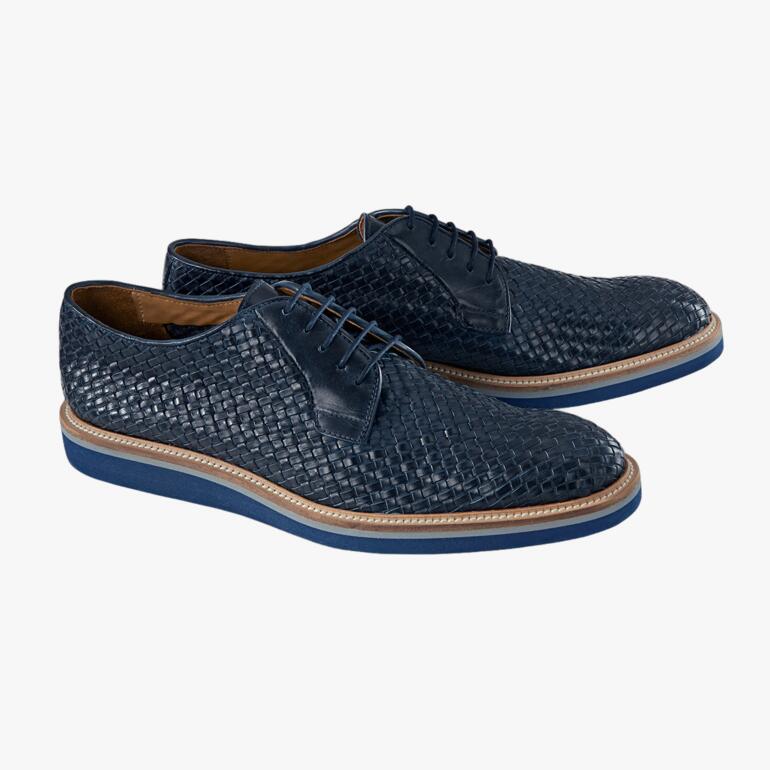 Deux derbys tressés bleu marine de Casanova, côte à côte sur un fond clair.