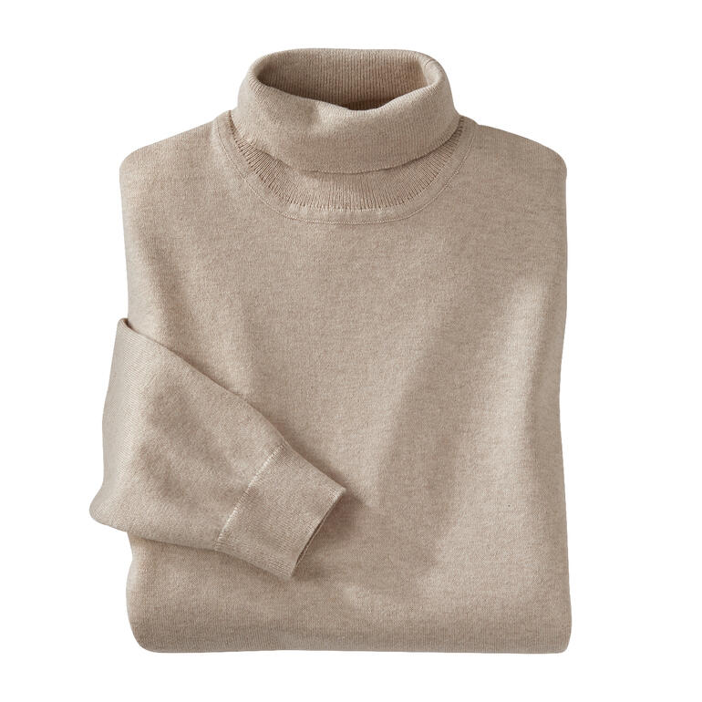 Crème Pull col roulé en tricot fin beige plié avec une manche.
