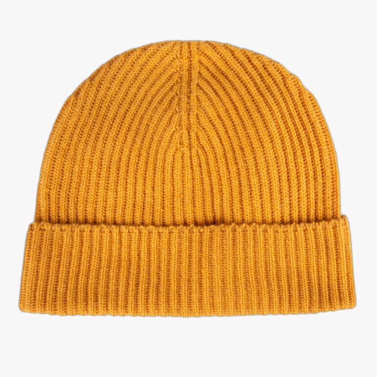 Bonnet de pêcheur en cachemire moutarde en matériau fin.