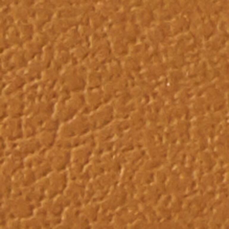 Cognac Texteur en cuir couleur bois, gros plan